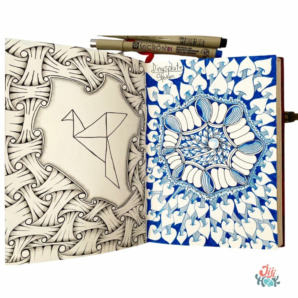 un carnet de dessin ouvert sur deux motifs zentangle placé sous deux stylo précision, motif zentangle et émotions